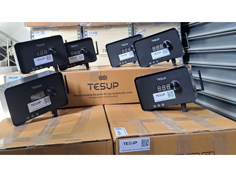 TESUP charge controllers with their display and dial, lined up on TESUP cartons in the warehouse