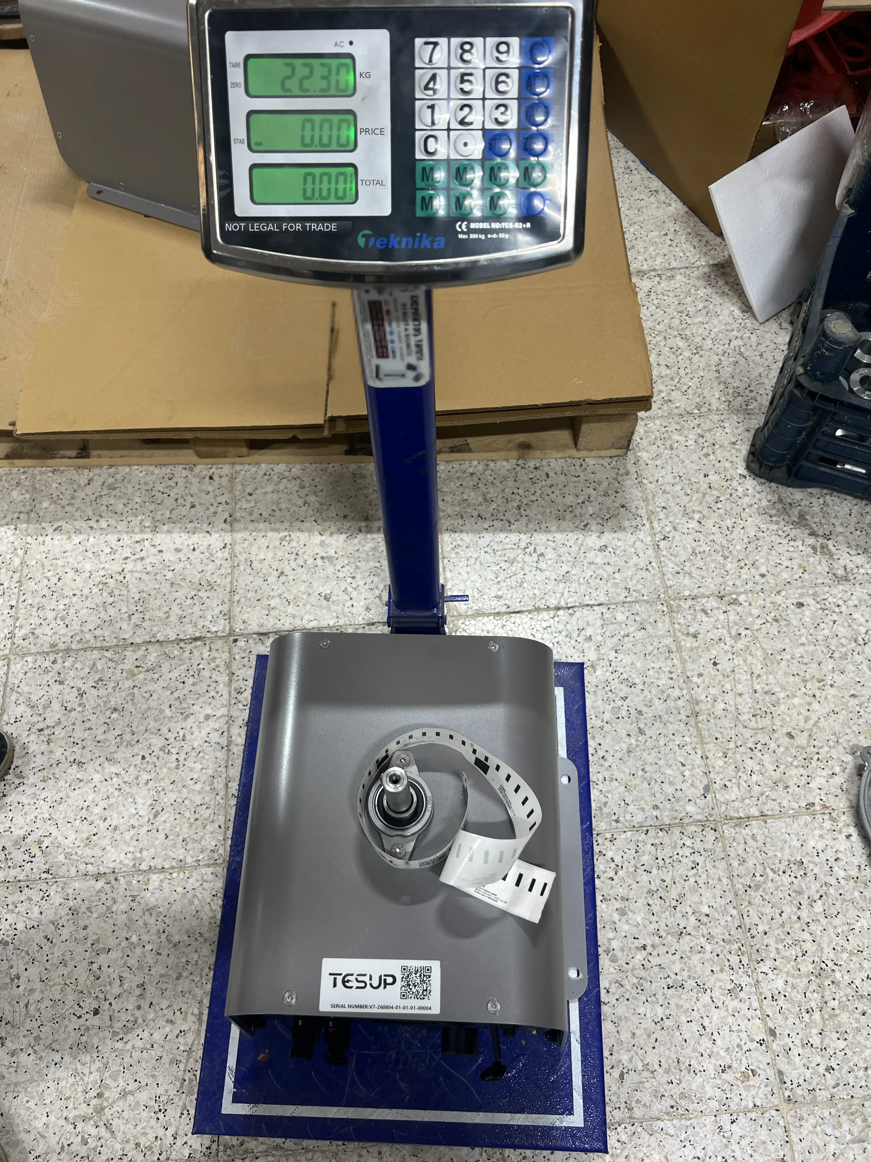 A TESUP Atlas wind turbine body on a workshop platform scale reading 22.30 kg