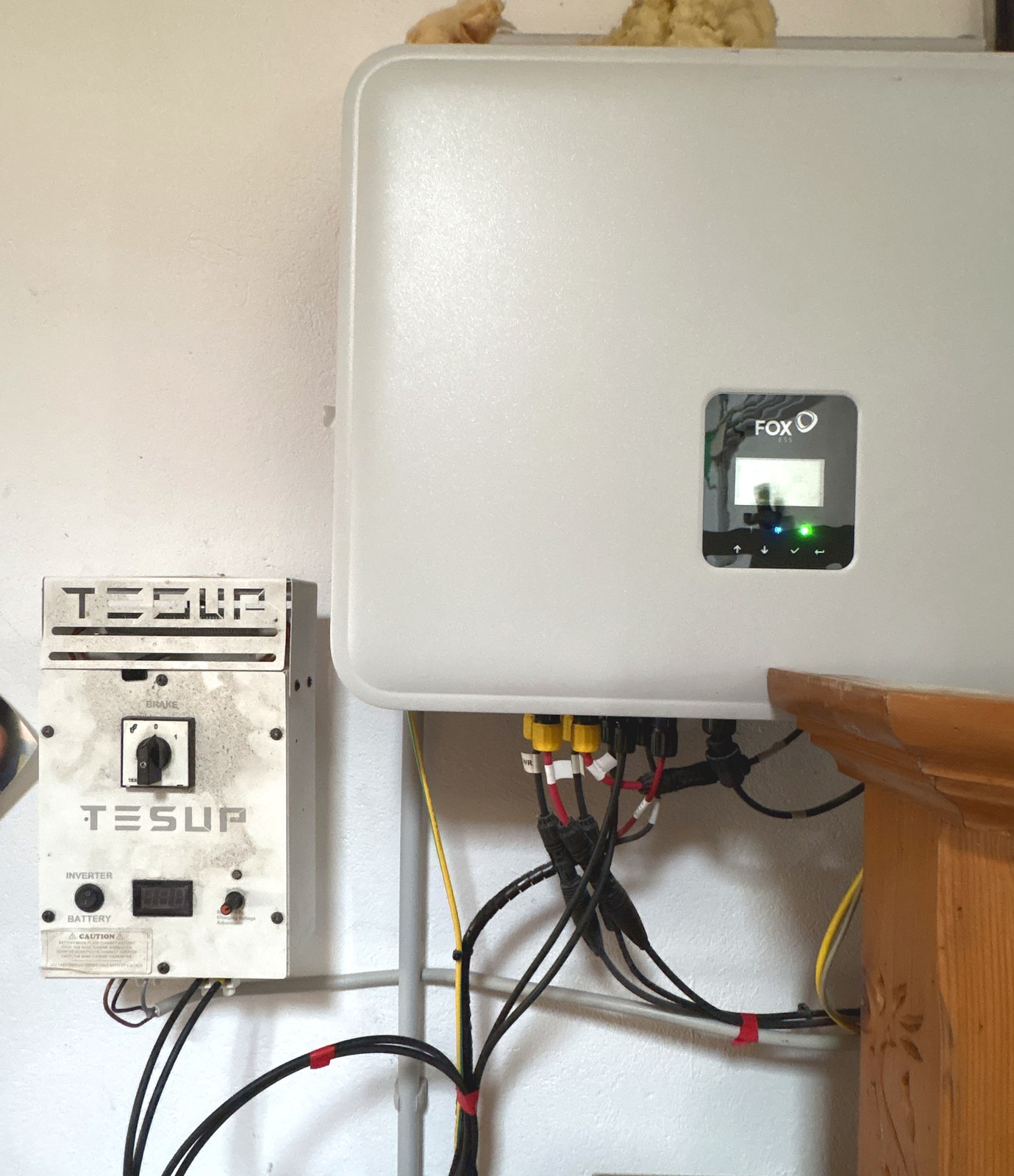 The 2020 TESUP controller beside a modern hybrid storage inverter