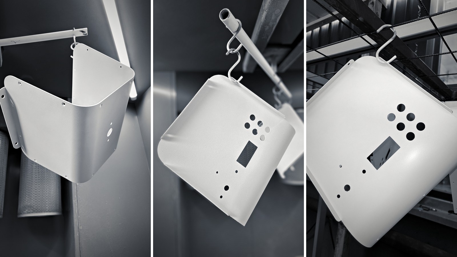 White powder-coated TESUP Atlas body panels and back covers hanging on hooks after coating
