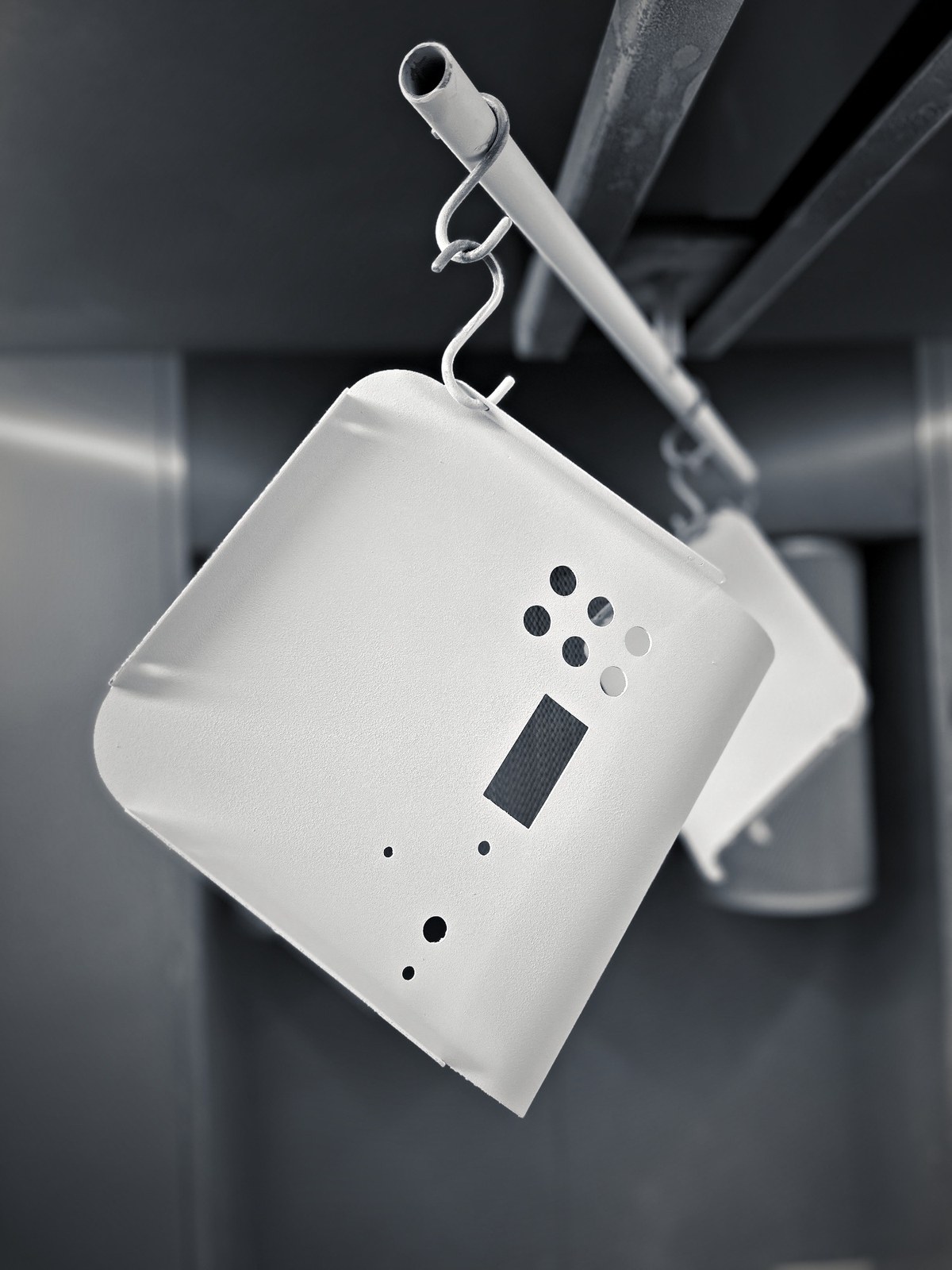 White powder-coated Atlas back cover with a rectangular window for the digital screen and round holes for the cable connections