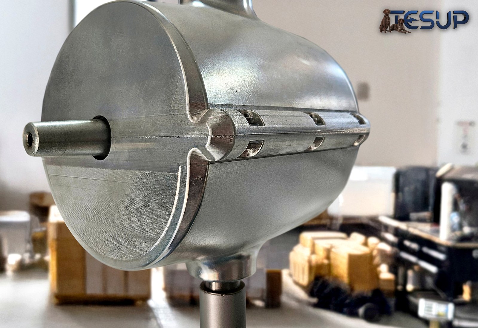 A finished, machined aluminium Magnum body with its shaft, standing in the TESUP workshop