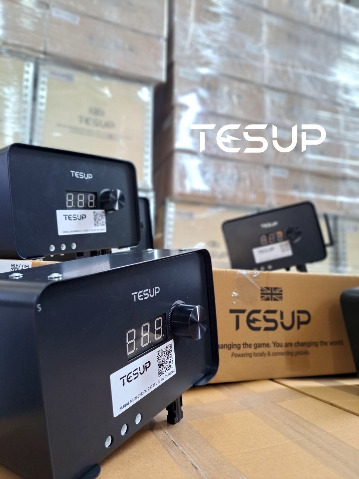 Close-up of a TESUP charge controller with its three-digit display, dial, serial-number label and indicator lights