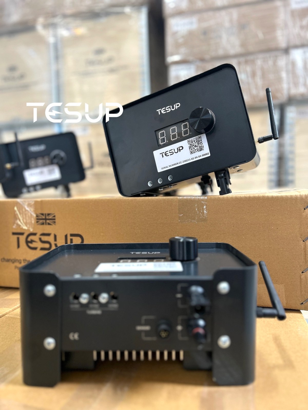 A TESUP charge controller seen from the front and another from the back, showing its connectors, sensor socket and cooling fins