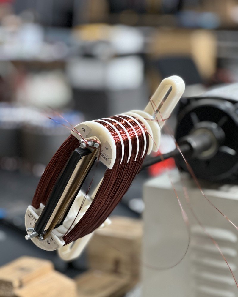 Enamelled copper wire being wound into a coil for a TESUP generator
