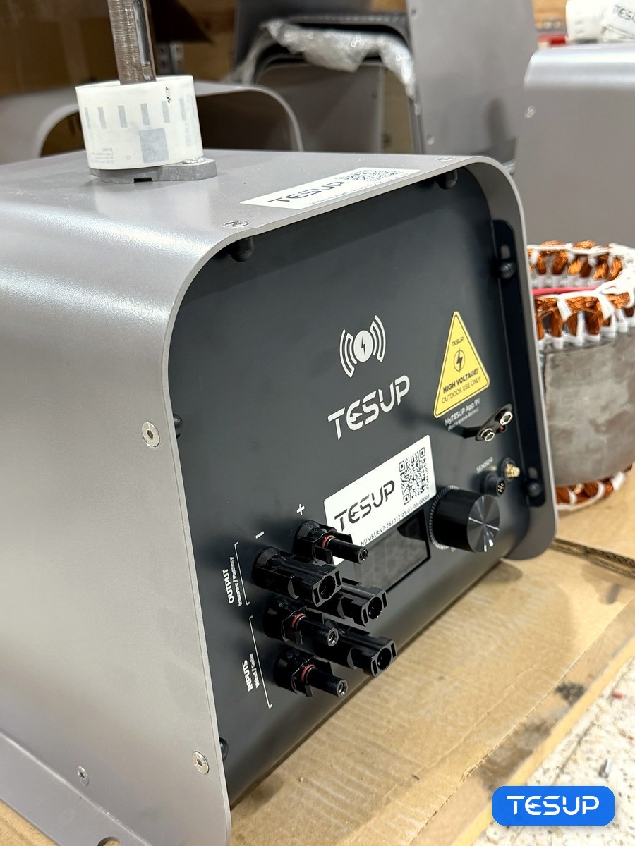 An Atlas generator on the workbench, its panel showing the inverter and battery output and the wind and solar inputs