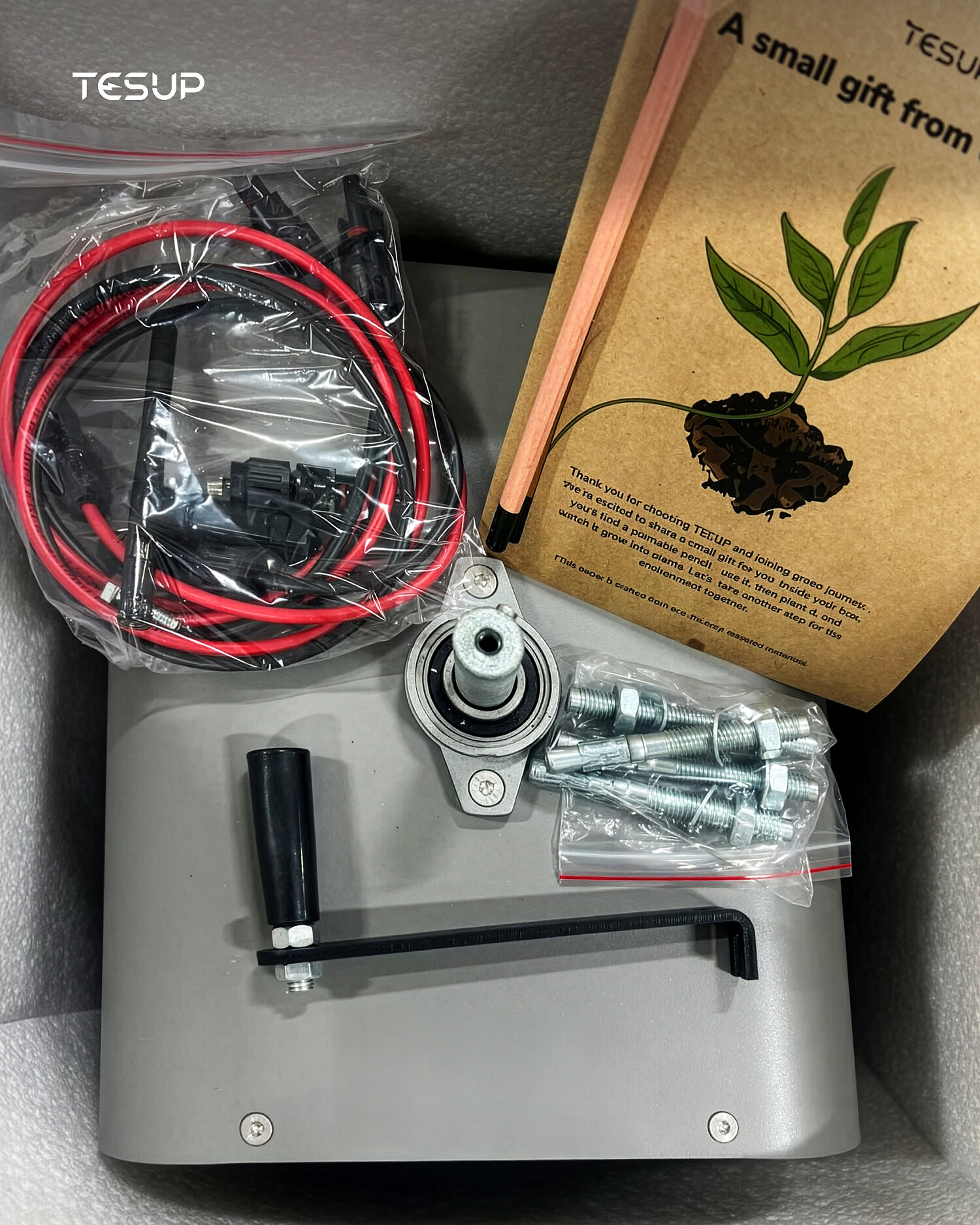 Inside a TESUP crate: cabling, mounting flange, fixings, hex keys and the manual