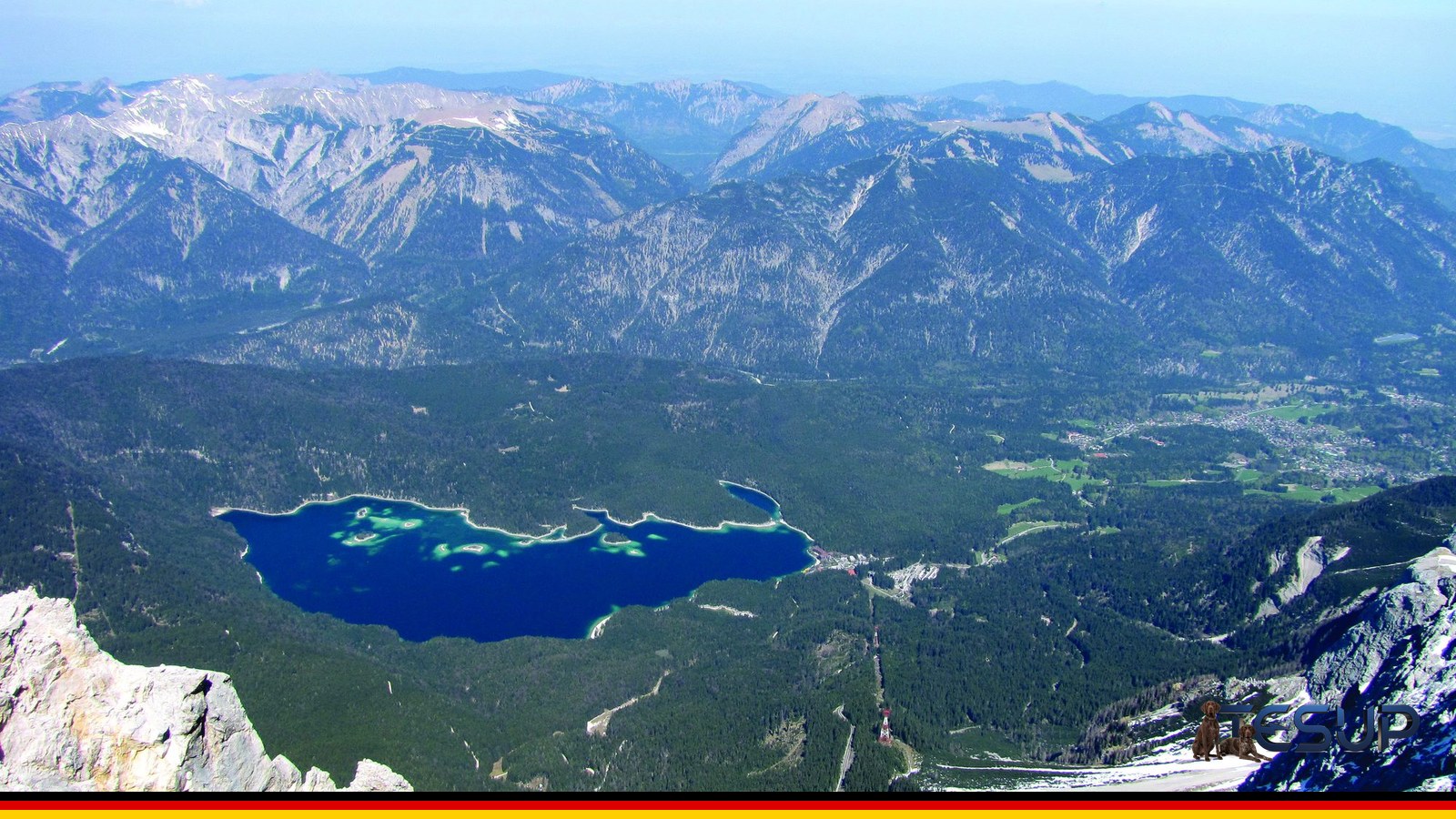 View from the summit of the Zugspitze, Germany's highest mountain, over the Eibsee lake and the Bavarian Alps